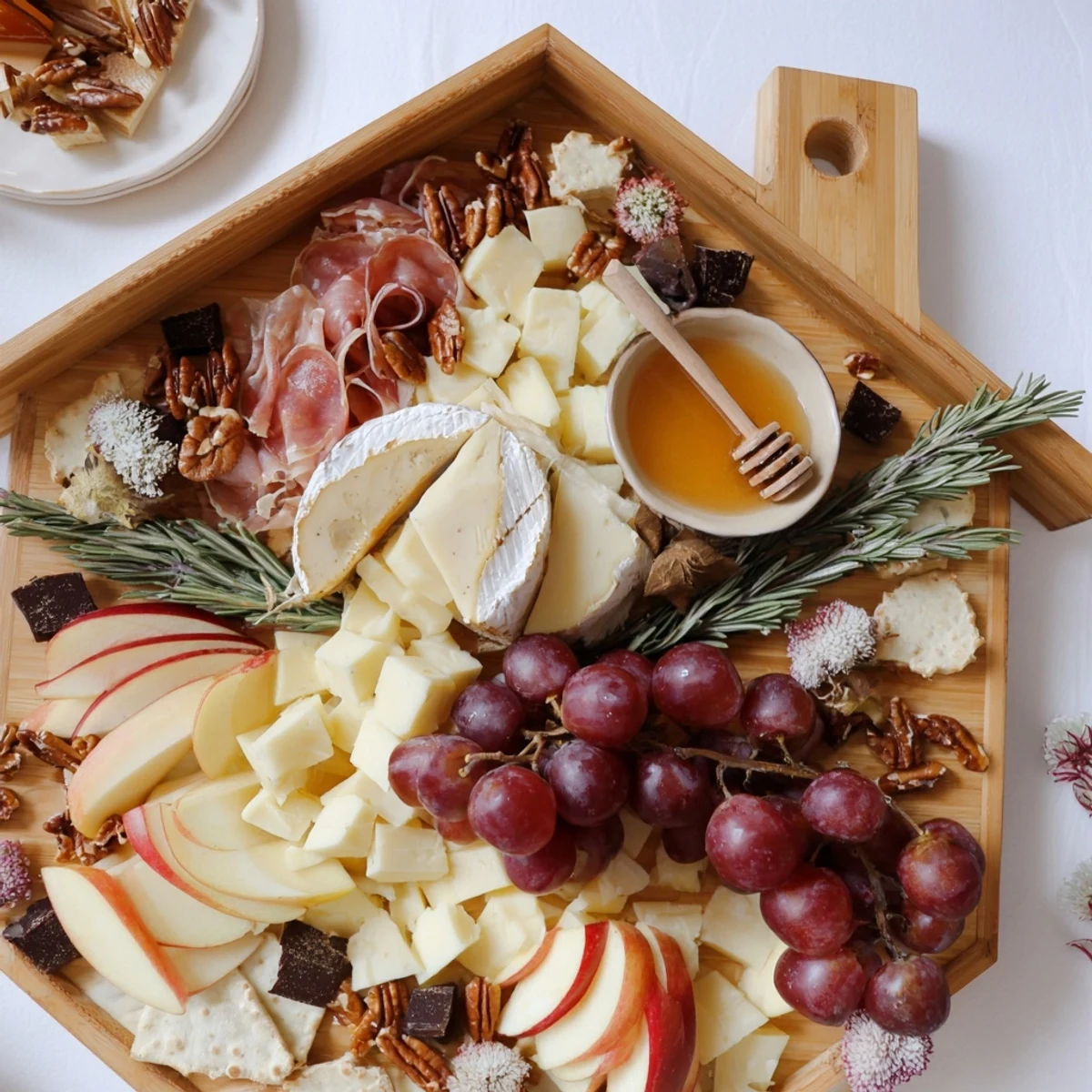 Sweet Home Charcuterie Board brimming with cheeses, fruits, and meats, perfect for sharing.