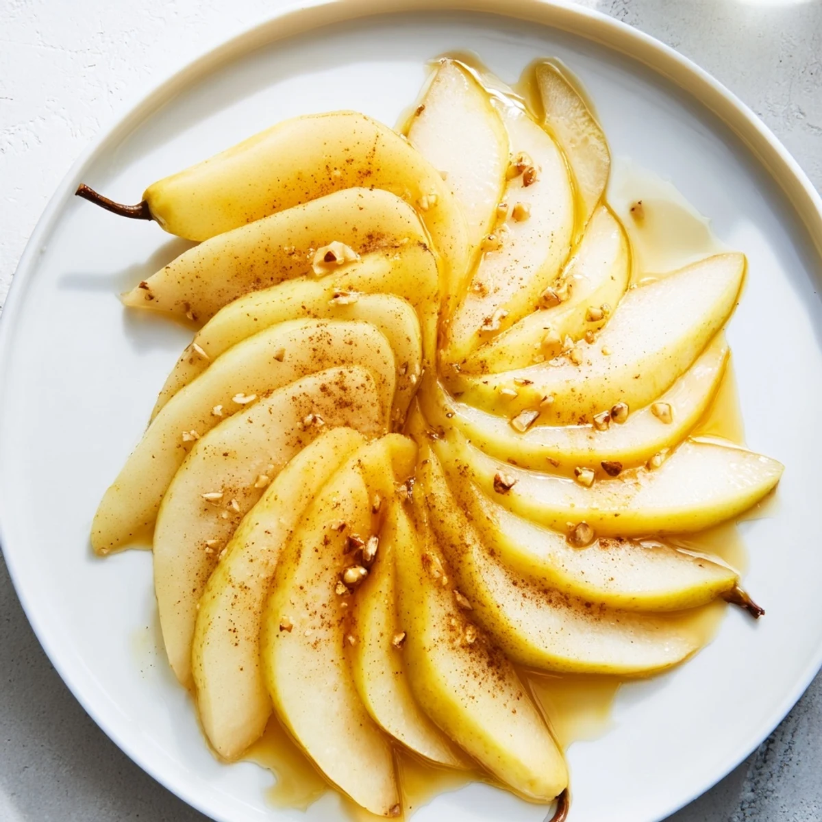 Beautiful arrangement of pear slices glistening with honey, ready to serve as a snack.