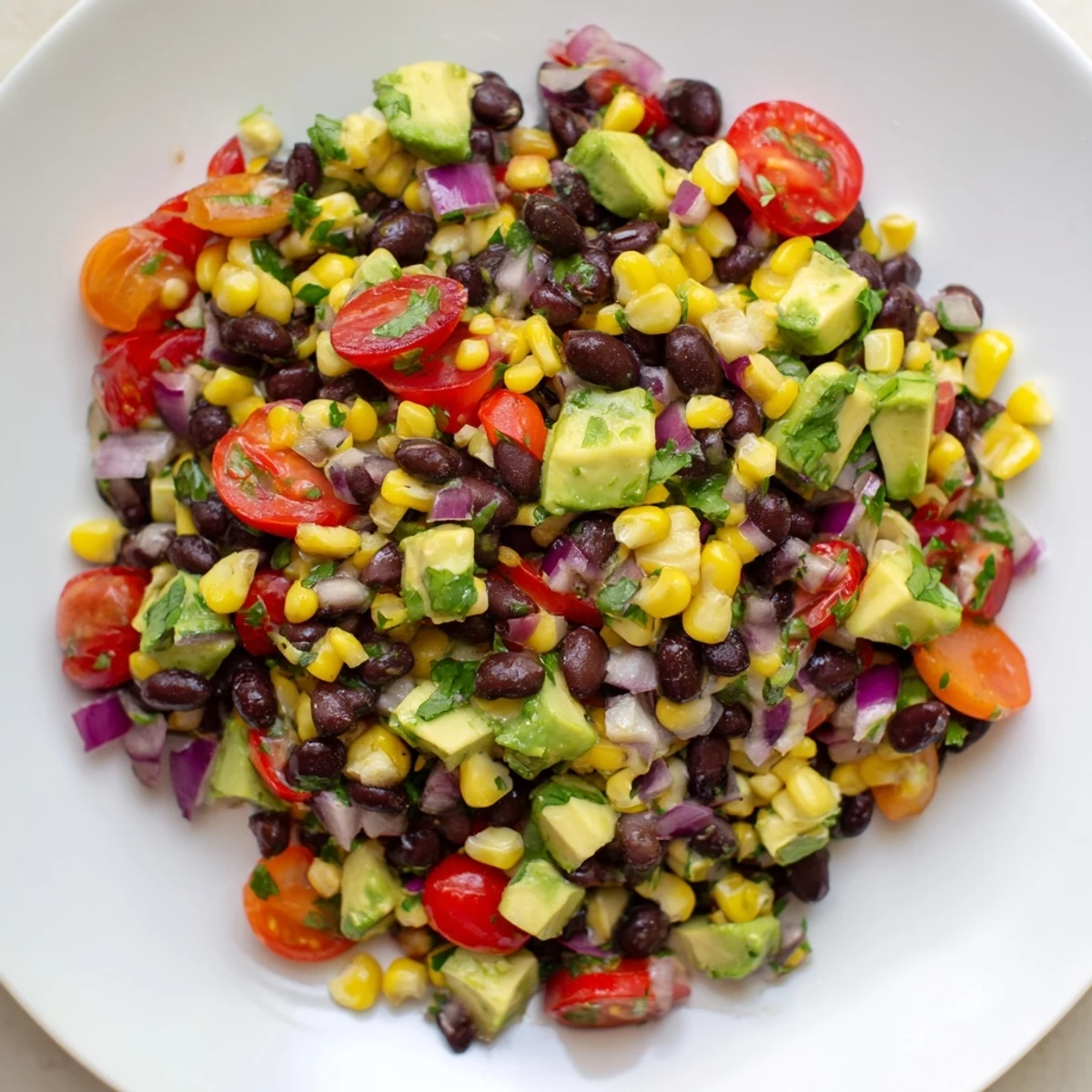 Vibrant Southwestern Black Bean and Corn Salad, a fiesta of colors, ready for a fresh, flavorful bite.