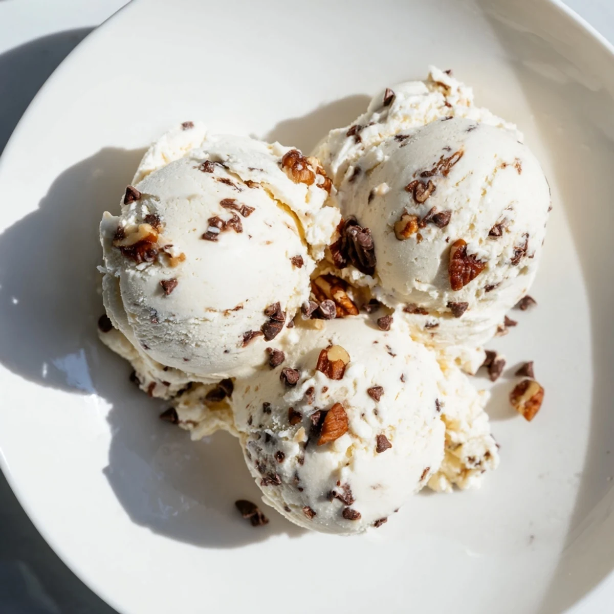 Smooth and creamy Cottage Cheese Ice Cream, swirled with fresh berries, ready to scoop.