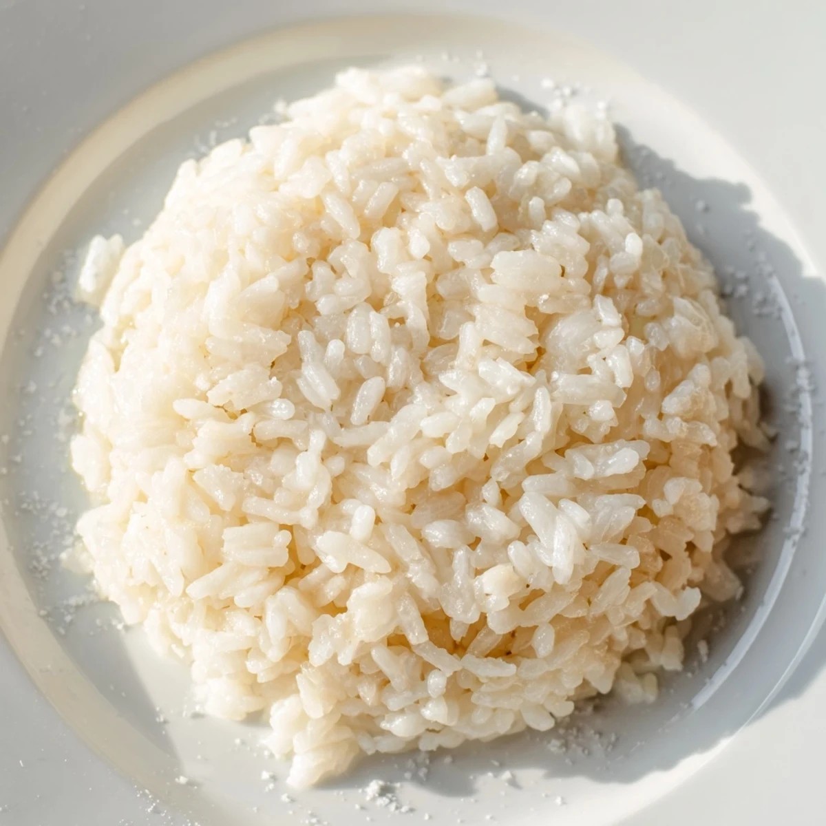Steaming Coconut Jasmine Rice, offering a comforting aroma to complement a savory curry.