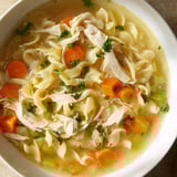 Homemade Classic Chicken Noodle Soup brimming with noodles, perfect for a cozy, comforting meal.
