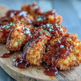 Golden, smoky vegan BBQ cauliflower wings served with cool, creamy ranch.