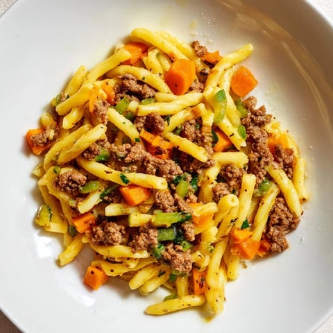Golden-brown, bubbly Viral Cheeseburger Casserole skillet, a comforting family meal ready to serve.