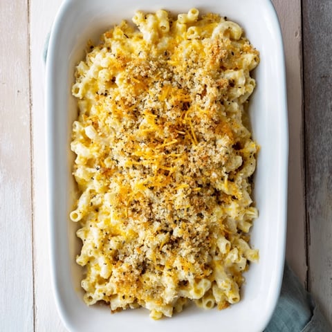 Golden, bubbly Old-Fashioned Baked Mac & Cheese with a crusty, cheesy breadcrumb topping.