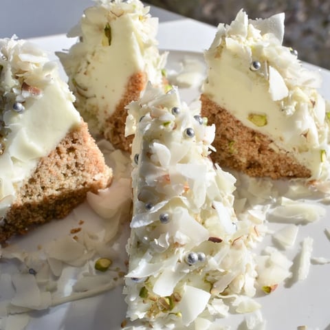 Freshly made Table d'Hiver Sapin et Flocons, a French dessert with snow-like coconut flakes and white mousse.