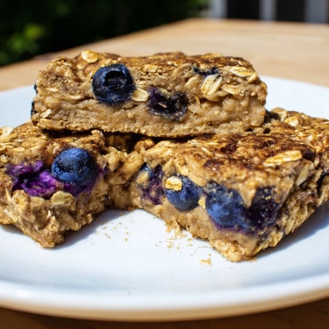 Golden Blueberry Banana Oatmeal Protein Bars, filled with juicy blueberries, ready to eat and enjoy for breakfast.