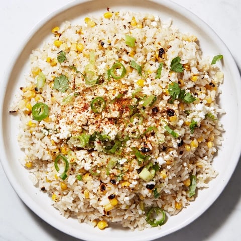 Fluffy Mexican Street Corn Rice, featuring charred corn and creamy cotija cheese, ready to serve.