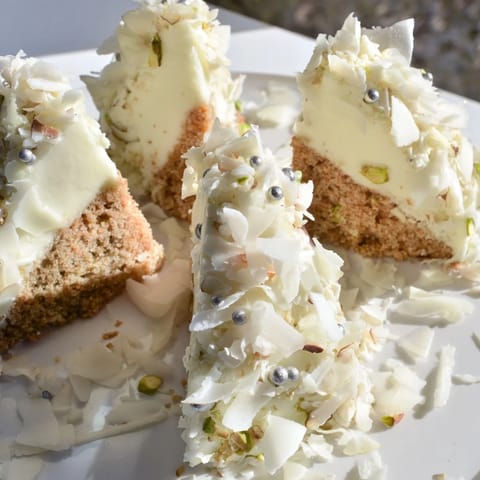 Freshly made Table d'Hiver Sapin et Flocons, a French dessert with snow-like coconut flakes and white mousse.