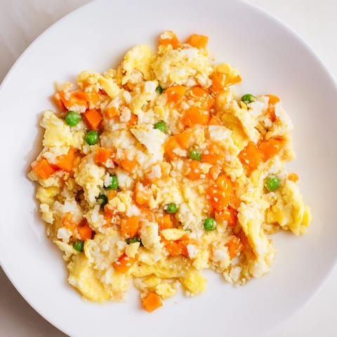 A close-up of golden-brown Egg Fried Rice, a quick and satisfying vegetarian weeknight dinner.