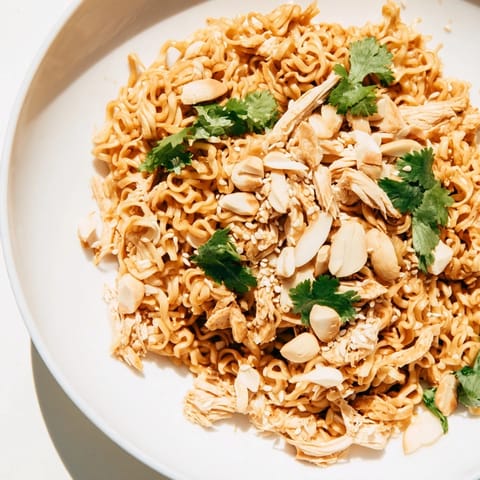 Crunchy Ramen Chicken Salad features tender rotisserie chicken, shredded cabbage, and toasted almonds tossed in a sweet sesame dressing.