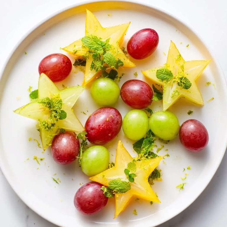 A delicious serving of sliced starfruit and grapes, a vibrant and healthy addition to brunch recipes.