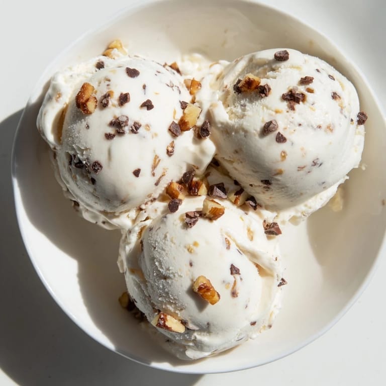 A bowl of fresh Cottage Cheese Ice Cream, a protein-rich treat with chocolate chips.