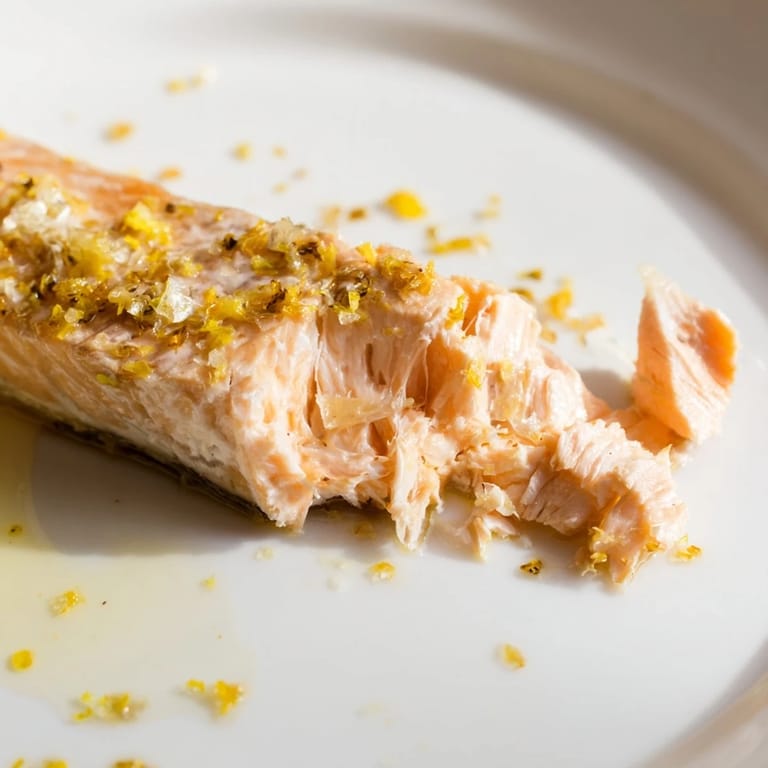 Lemon Herb Salmon Salad features warm fish over fluffy quinoa, crisp cucumbers, and bright herbs, perfect for a healthy lunch.  