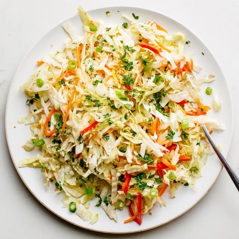 Healthy Sauerkraut Slaw pairing perfectly with grilled sausages, featuring fermented cabbage and a tangy Dijon mustard dressing for a gut-friendly side dish.
